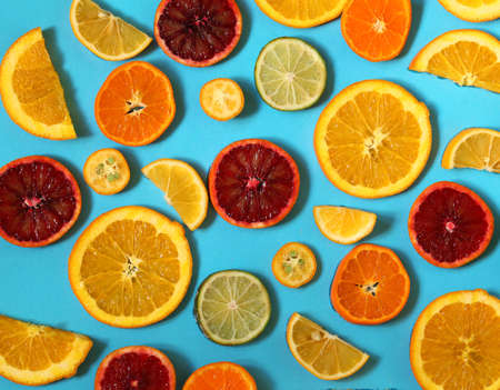 natural organic citrus fruits on a blue backgroundの写真素材