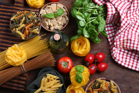 still life italian food pasta tomatoes garlic basil and olive oilの写真素材
