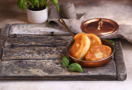 fried homemade pies with potatoes