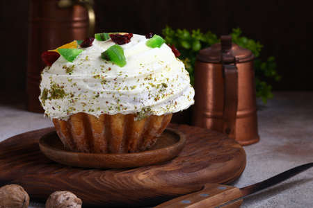 homemade cupcake with candied fruit and icing sweet dessertの写真素材