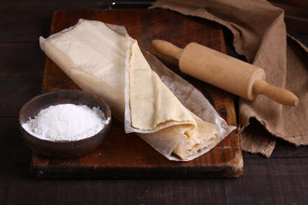 raw flaky homemade dough on the table