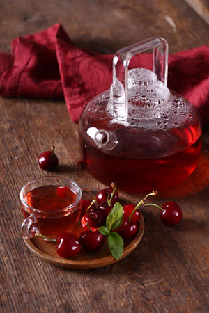 cherry berry tea on a wooden tableの写真素材