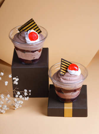 chocolate dessert in a glass on a colorful backgroundの写真素材