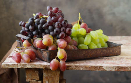 ripe organic grapes on a wooden table