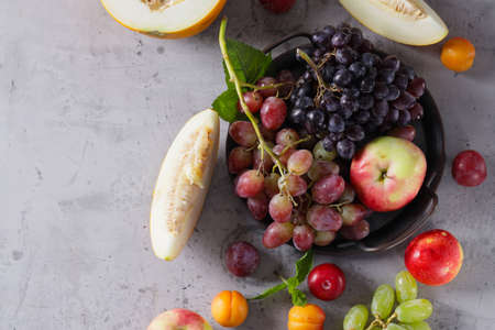 autumn harvest fruit melon grapes applesの写真素材