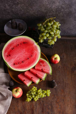 autumn harvest fruit watermelon grapes and applesの写真素材