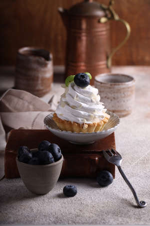 mini cake basket with meringue creamの写真素材