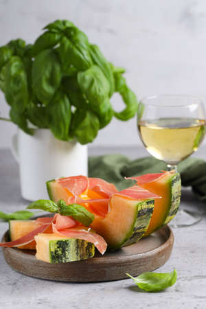 Italian appetizer melon and prosciutto hamの写真素材