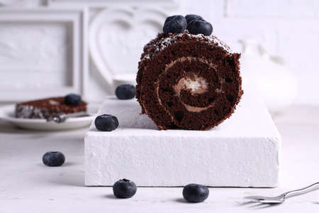 chocolate roll with blueberries for dessertの写真素材