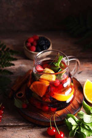 fruit berry tea in a glass teapotの写真素材