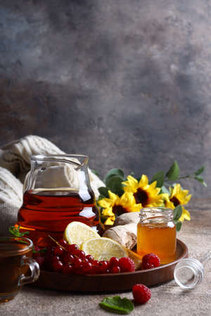 autumn background with scarf tea ginger and lemonの写真素材