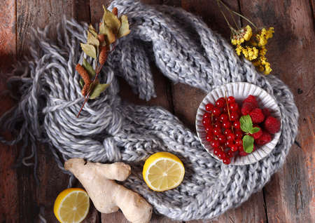 autumn background with scarf and ginger and lemonの写真素材