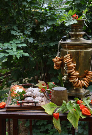 still life Russian samovar with dryers in the garden