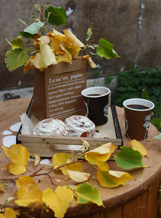 autumn still life with cinnamon rolls