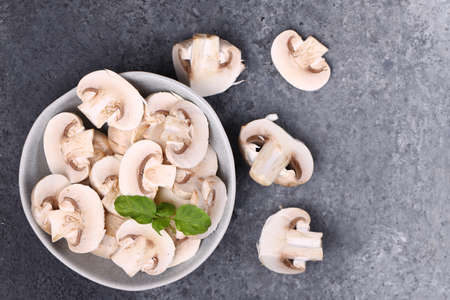 ripe organic champinton mushrooms on the tableの写真素材
