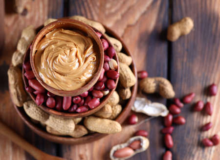 natural organic peanut butter on the tableの写真素材