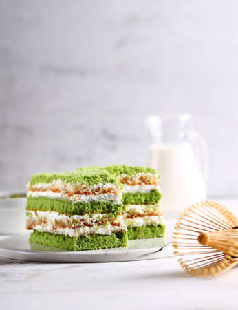 green cake with matcha tea for dessertの写真素材