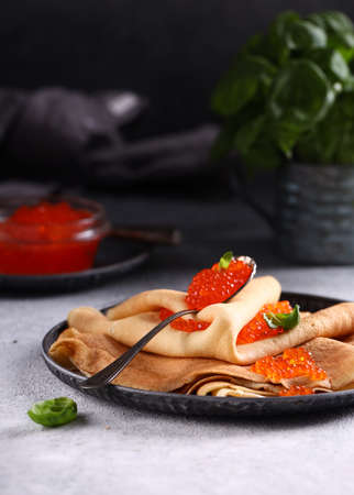 red gourmet caviar with pancakesの写真素材