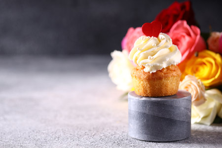 cupcake with vanilla cream for a holiday treatの写真素材