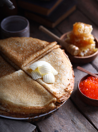 traditional Russian pancakes and samovar, rustic carnival style