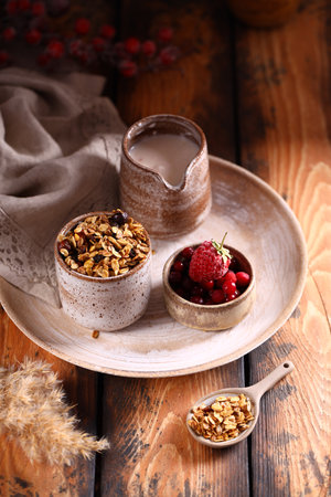 healthy breakfast muesli with berries and milk