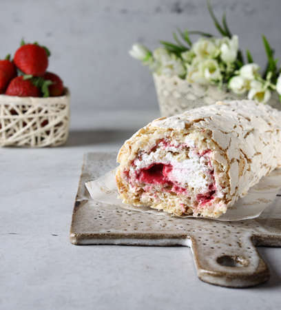 meringue roll with cream and berries dessert