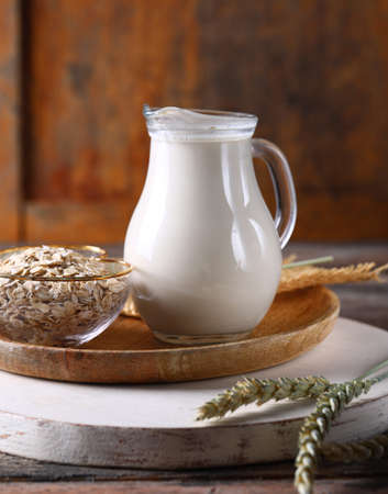 oatmeal vegetable milk in a glass jugの写真素材