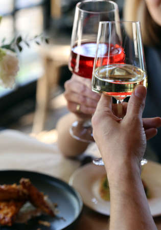hands glass with alcohol for a holiday or a party