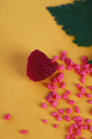 fresh raspberries with green leaves