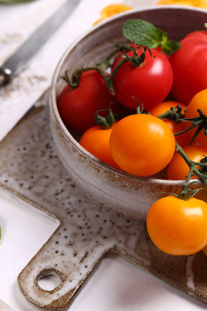 fresh organic tomatoes on the tableの写真素材