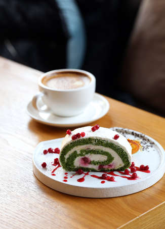 pistachio roll dessert with raspberriesの写真素材