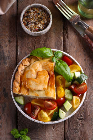 homemade meat pie on a wooden table