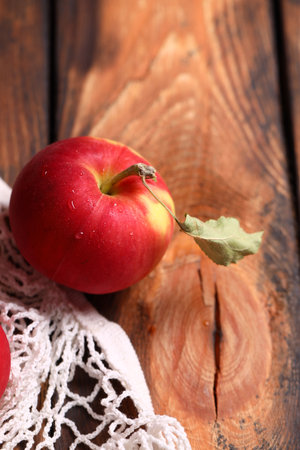 ripe organic apples on a wooden tableの写真素材