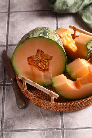 ripe organic orange melon on the table