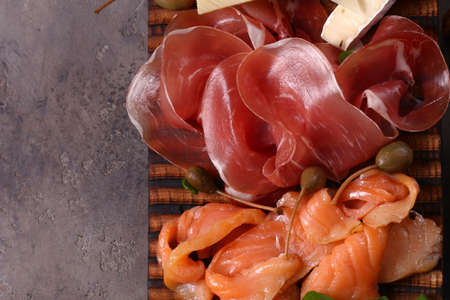 assorted ham, salmon and salami sausage - antipasti appetizerの写真素材