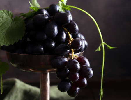organic fresh grapes on a wooden tableの写真素材