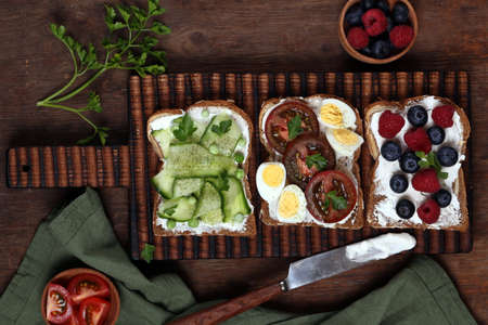 sandwiches with different fillings - vegetables, ham and egg