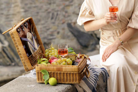 wicker picnic basket with wineの写真素材