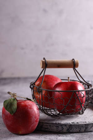 natural organic fruit apples on the table in a basketの写真素材