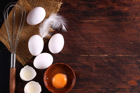 fresh organic eggs on wooden tableの写真素材