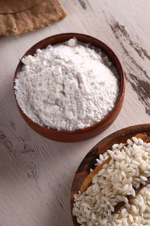 gluten free rice flour in a wooden bowlの写真素材