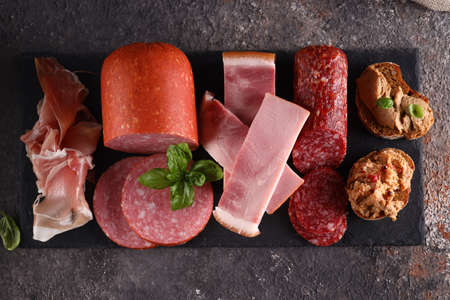 delicacy food smoked sausages and hamの写真素材