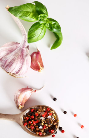 food background with fresh garlic herbs on white backgroundの写真素材