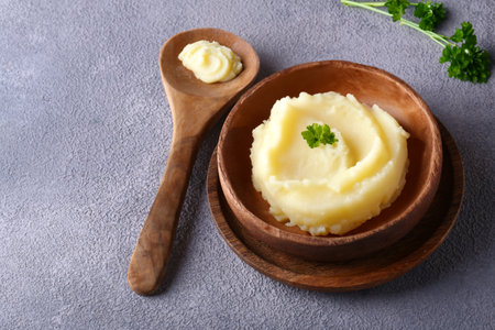mashed potatoes in a wooden bowl on the table, healthy foodの写真素材