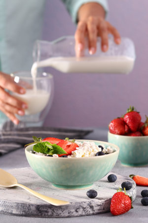 cottage cheese with fresh berries for breakfastの写真素材