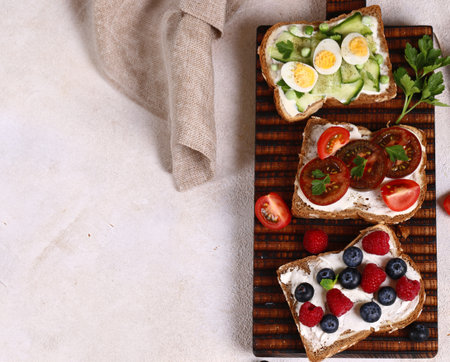 various sandwiches for a healthy diet on a wooden boardの写真素材