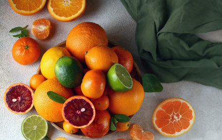 natural organic citrus fruit on a wooden plateの写真素材