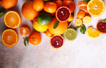 natural organic citrus fruit on a wooden plateの写真素材