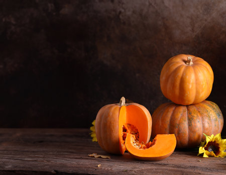 autumn background with pumpkins and yellow leavesの写真素材