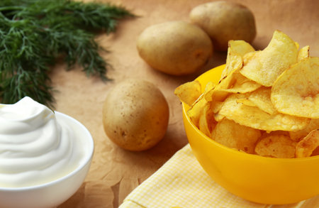 organic potato chips in a snack bowlの写真素材